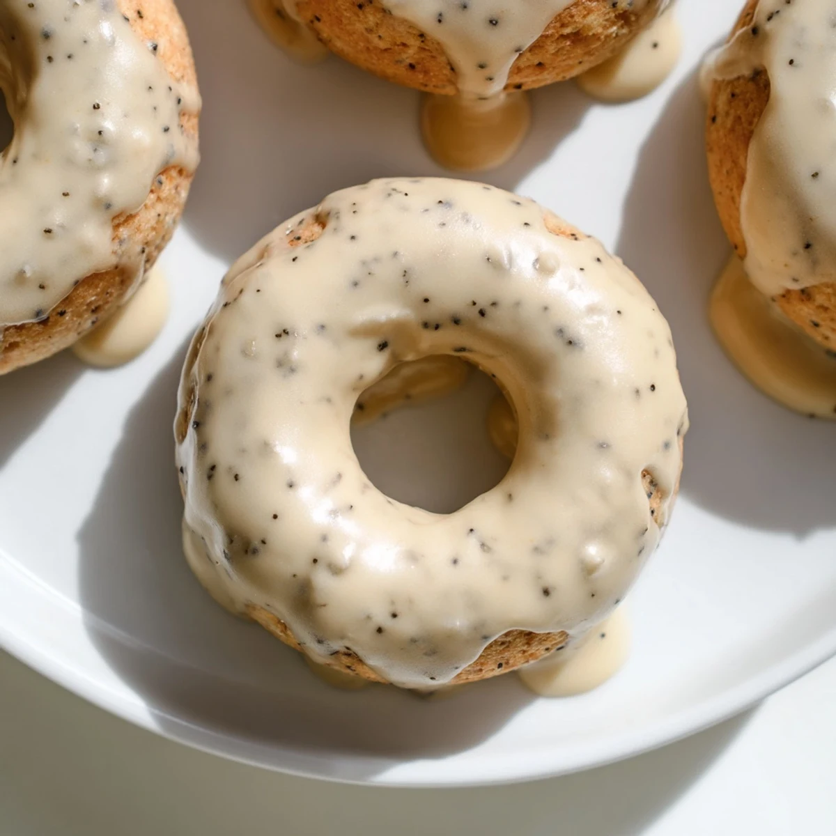 Freshly baked donuts infused with fragrant Earl Grey tea, drizzled with a glossy white icing coating