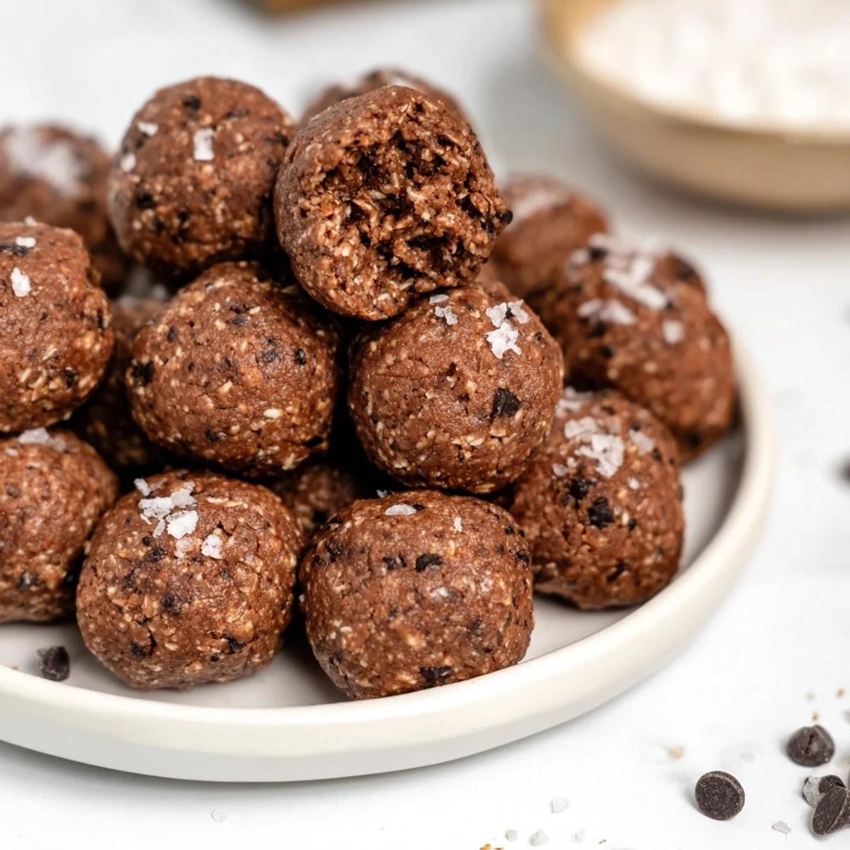 Dark chocolate no bake chocolate peanut butter protein balls arranged on parchment paper for easy meal prep