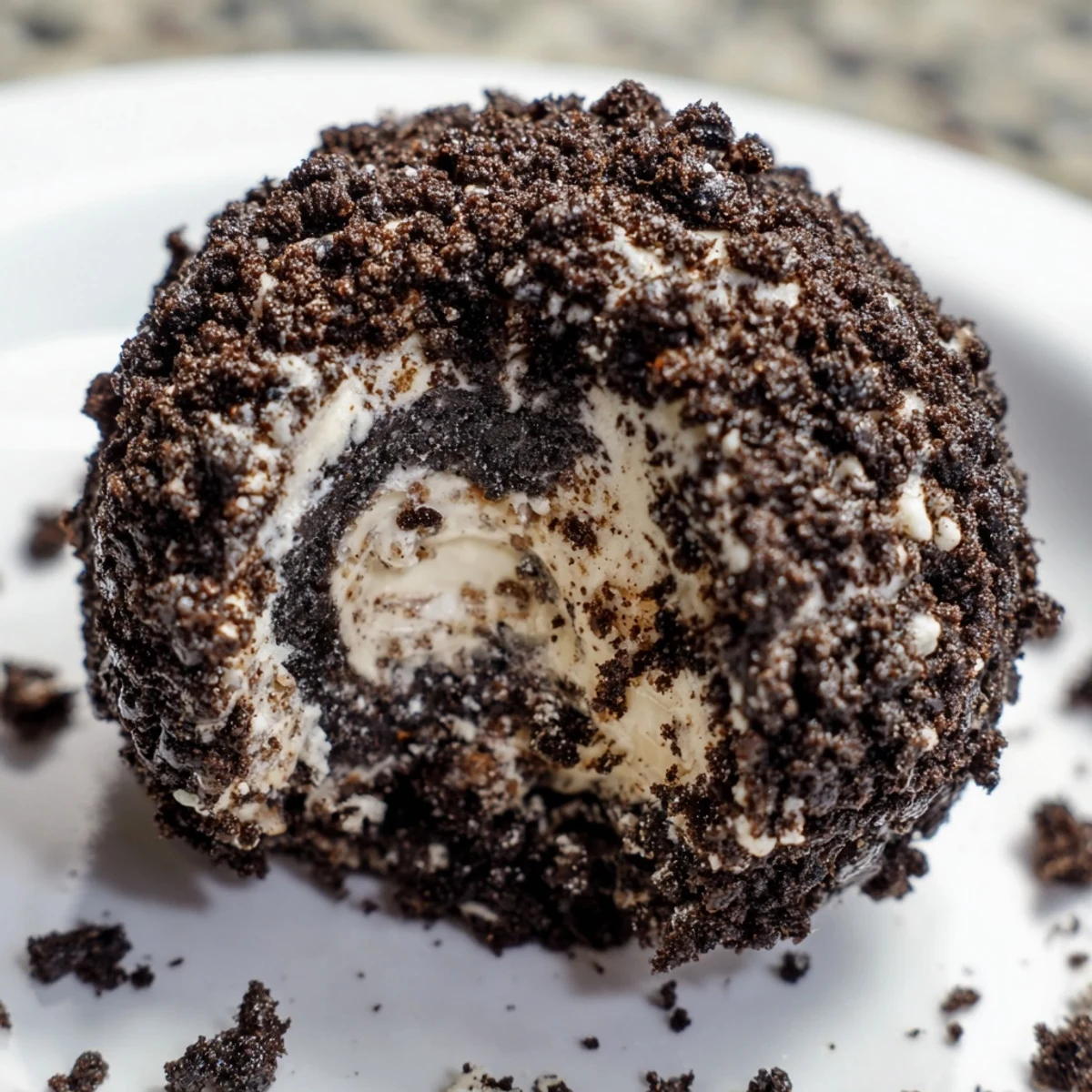 Rich Cream Cheese Oreo Protein Balls arranged on serving platter with extra Oreo coating visible