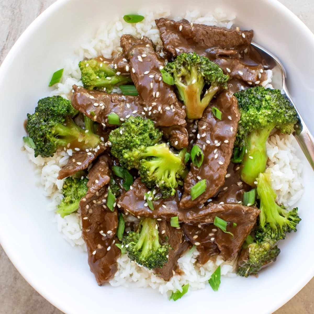 Chinese-American beef and broccoli bowl featuring tender meat and bright green vegetables