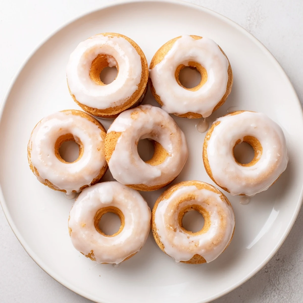 Light and fluffy Greek yogurt cake donuts fresh from the oven cooling on rack