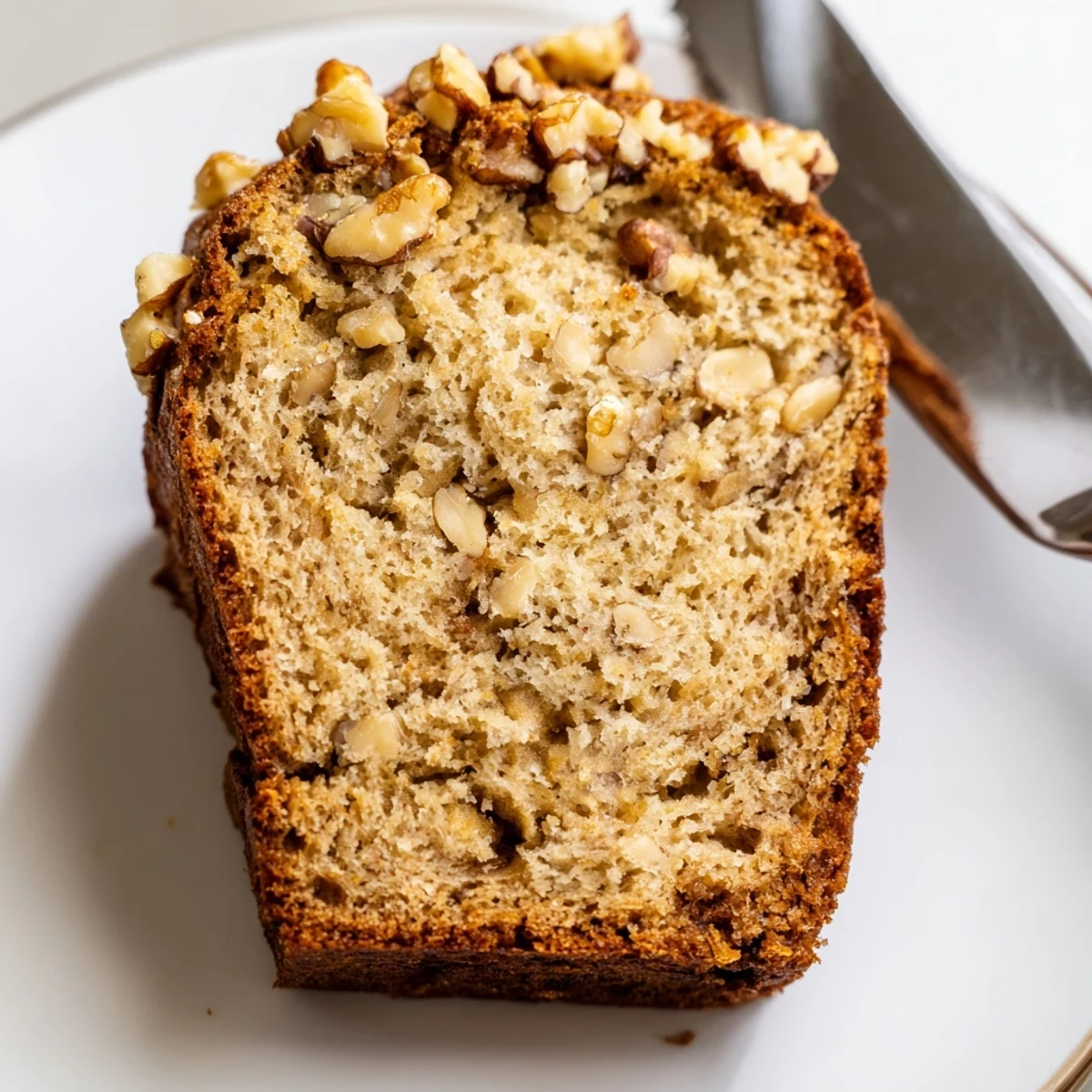 Moist banana nut bread with a tender crumb served with morning coffee