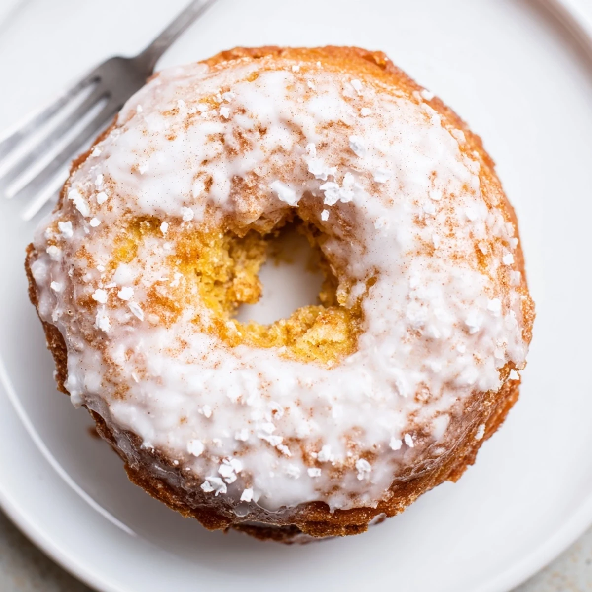 Fresh baked Banana Donuts cooling on a rack, tender cake texture