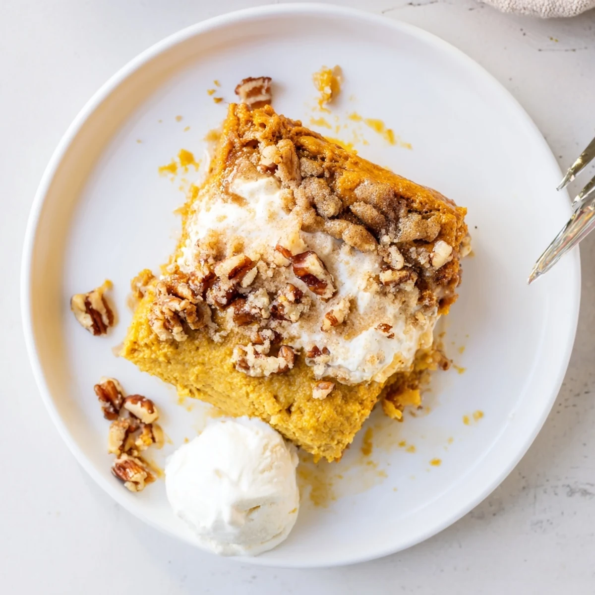 Baked Pumpkin Dump Cake cooling in pan, crackled buttery crust and warm spice