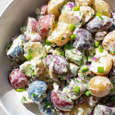 Creamy Red White Blue Potato Salad featuring colorful tender potatoes and tangy dressing